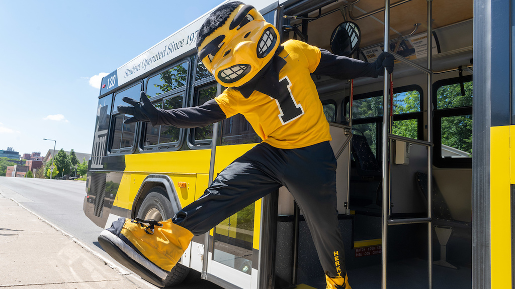 Herky waving as he leans out of the CAMBUS door