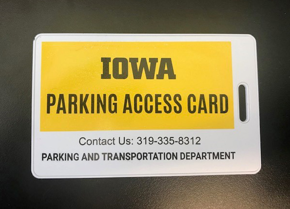 white access card on black background with graphic on card in gold and black reading Iowa Parking Access Card and department phone number