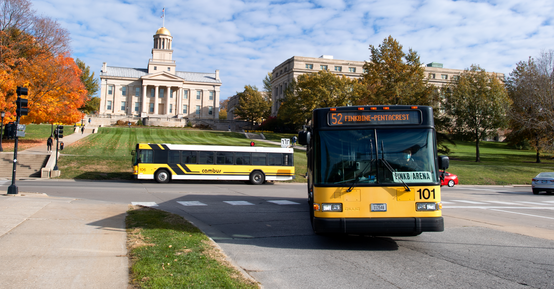 two CAMBUS drive in front of the old capitol in Iowa City