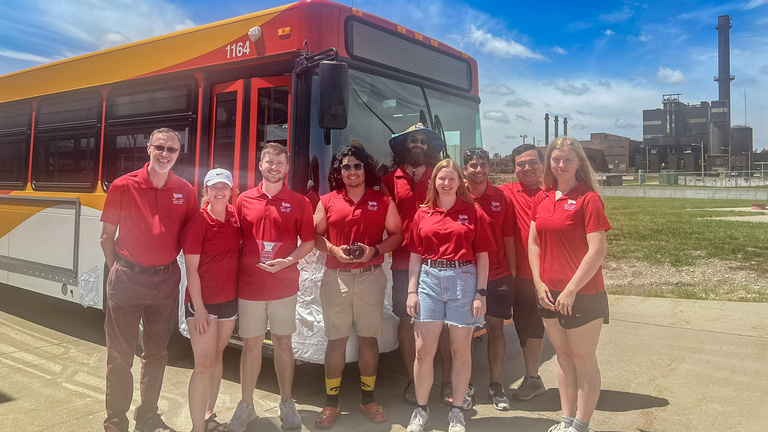 CAMBUS student employees pose in front of a bus at the 2024 state roadeo