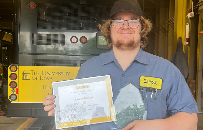 2024 support person of the year John Underwood poses with his award