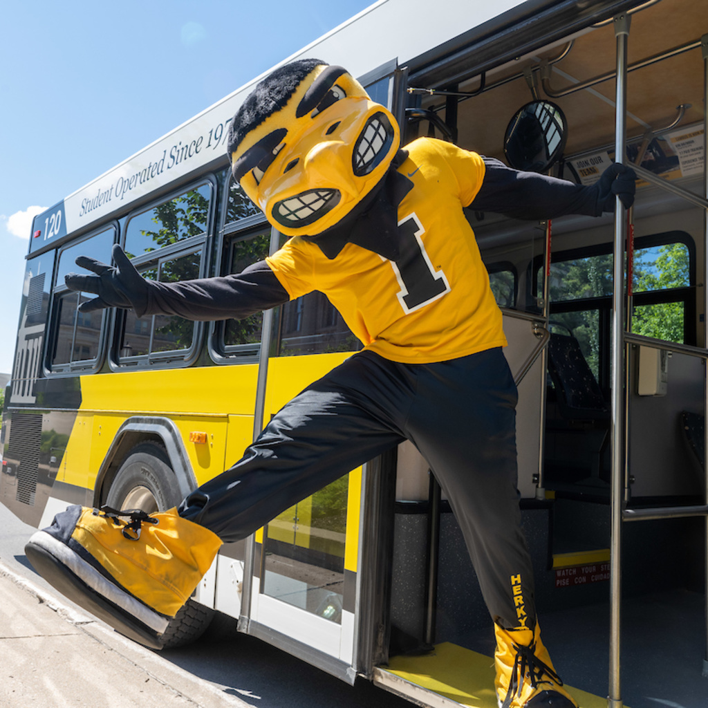 Herky waving as he leans out of the CAMBUS door