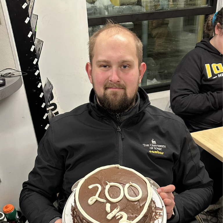 Driver Ben Koch poses with cake