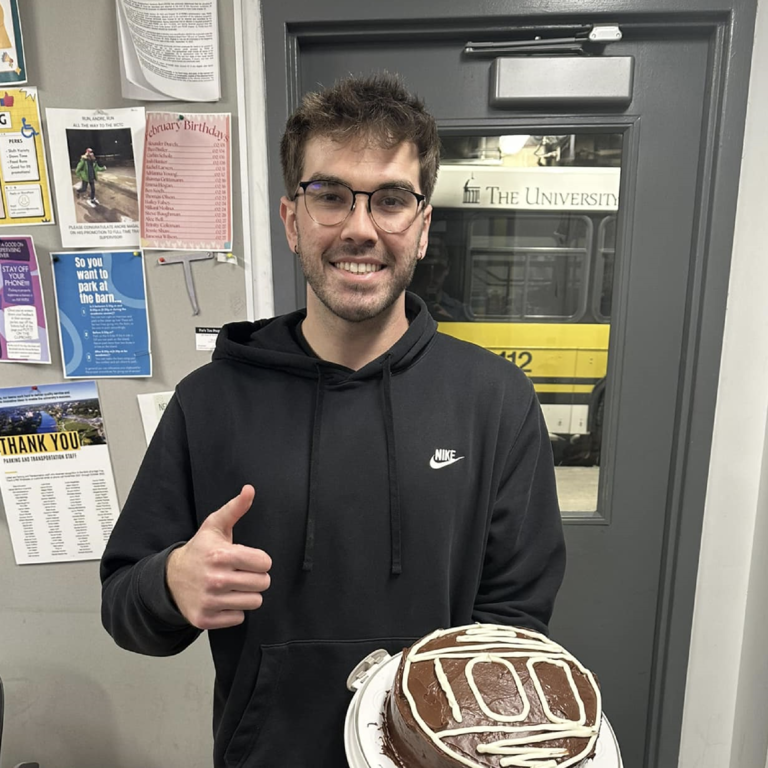 Driver Zach poses with a cake