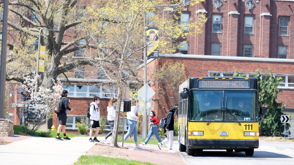 students boarding CAMBUS outside of Hillcrest