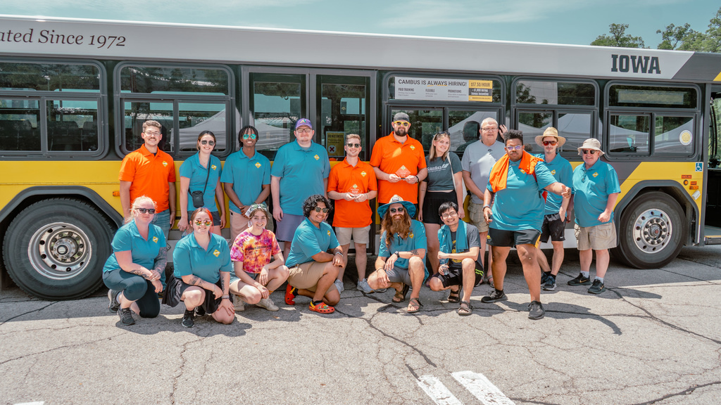 CAMBUS student employees and volunteers in front of a bus at the 2023 IPTA state roadeo