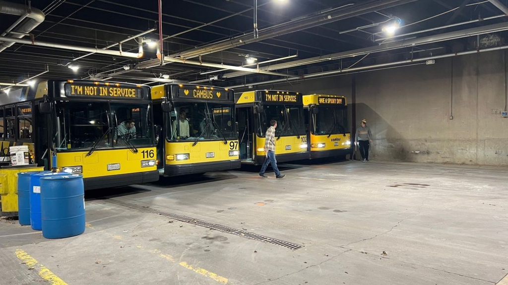 A photo of the CAMBUS fleet lined up at the maintenance facility