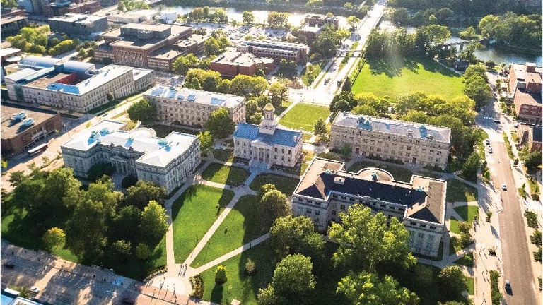 aerial image of campus on sunny day with Pentacrest at center